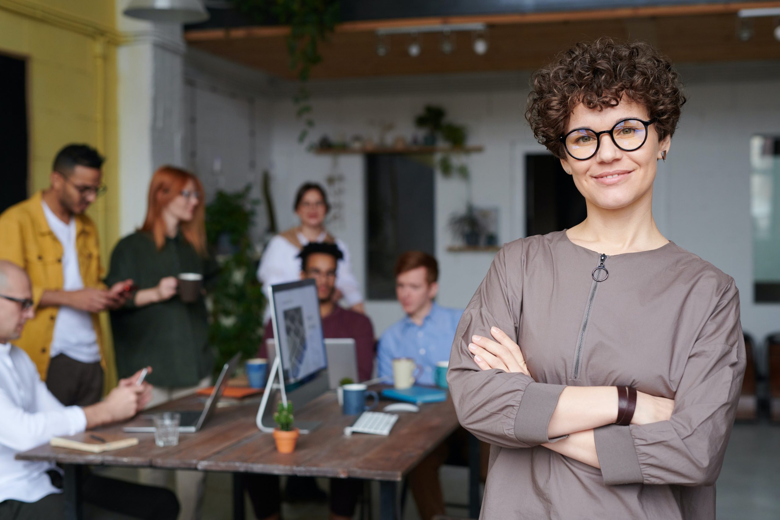 Business Owner and Employees Discussing Retirement Plans