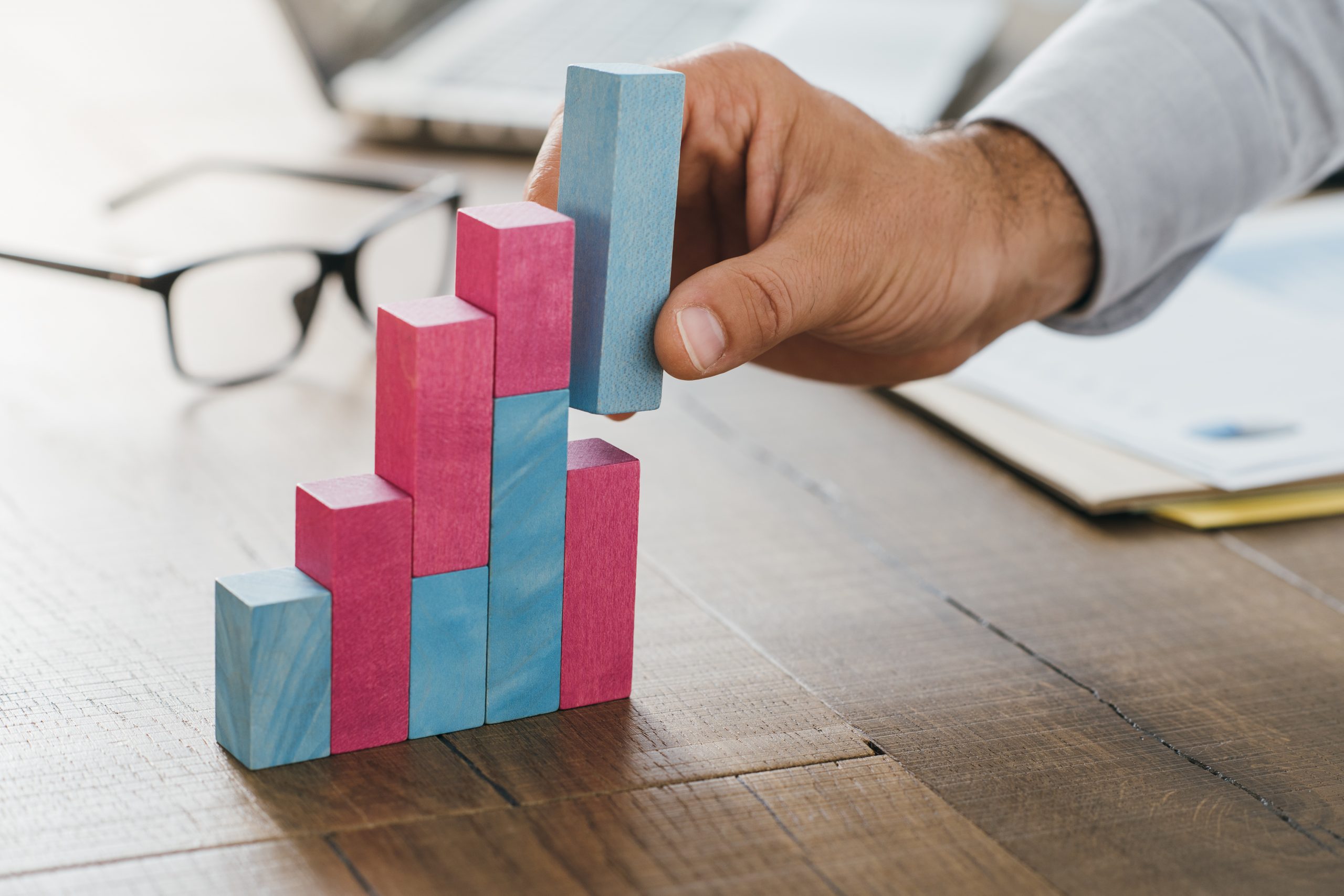 Businessman building a successful financial graph stable account