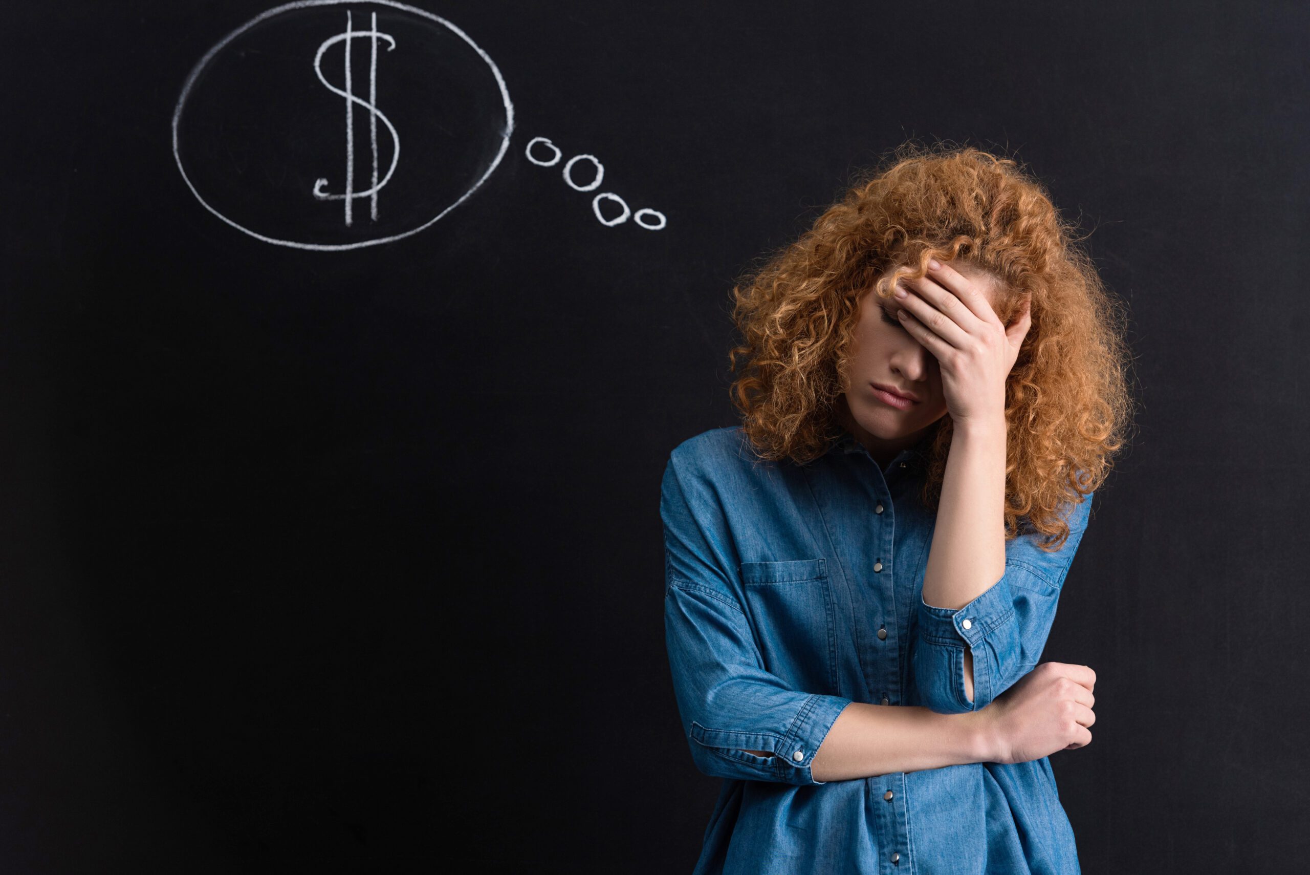 upset pensive girl with dollar sign.