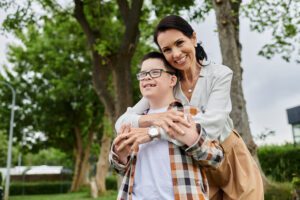 mother-and-son-embracing-in-park